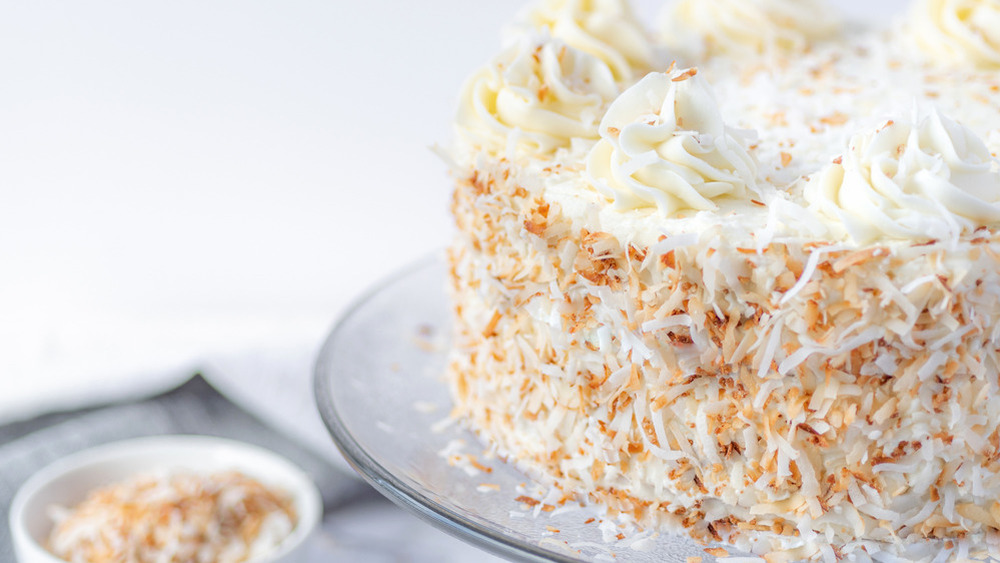 White cake covered in coconut 