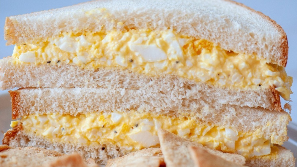 Egg salad sandwiches stacked on top of each other