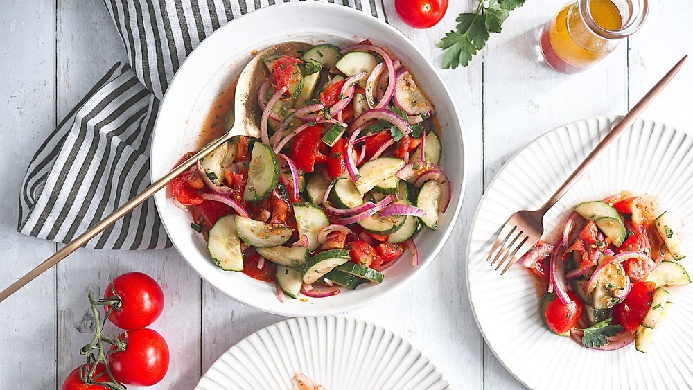 Salad with cucumbers, tomatoes and onions