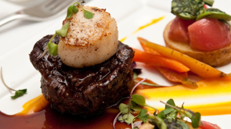 Seared scallop atop steak filet