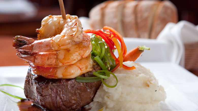 Filet mignon with shrimp skewered atop