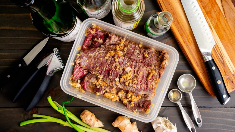 seasoned skirt steak in container