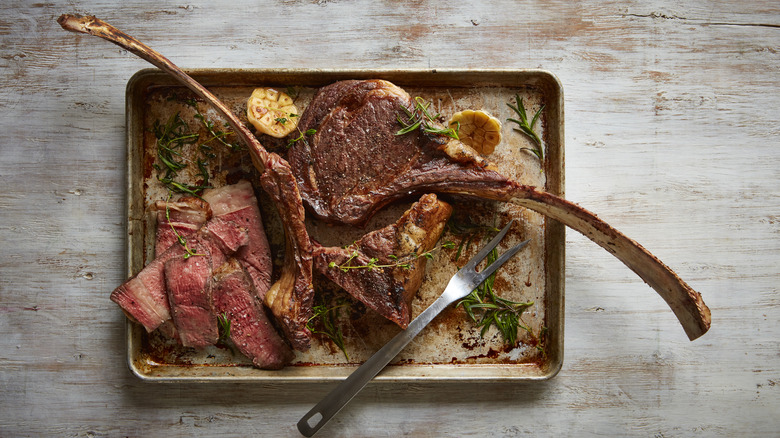 tomahawk steaks on tray