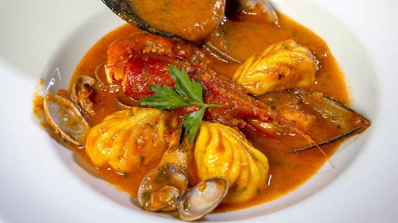 seafood-stuffed pasta with clams and tomato sauce