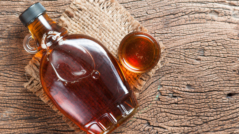 Glass bottle of maple syrup