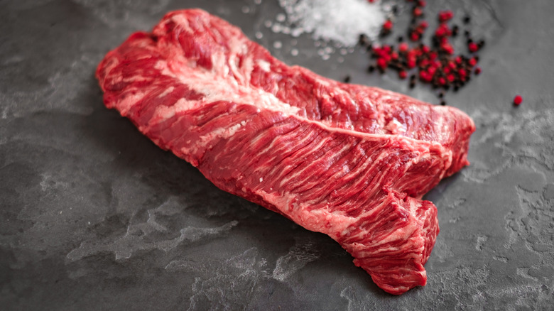 Hanger steak on a stone slab with spices