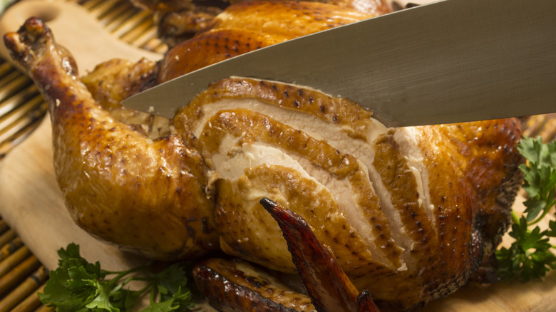 Chicken being carved