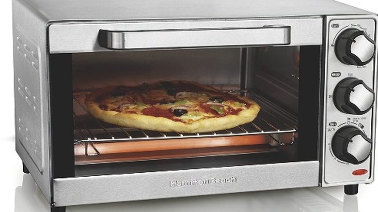 toaster oven with pizza in it