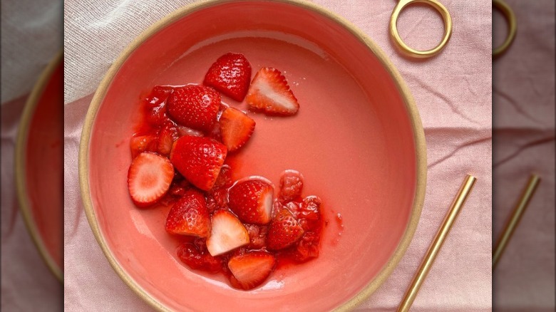 Macerated strawberries in pink bowl