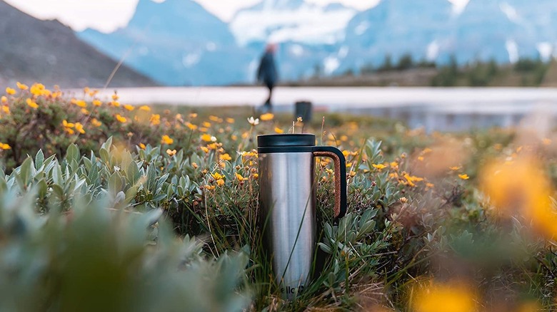 Ello Magnet coffee mug in field 