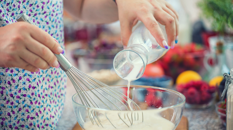 person mixing batter