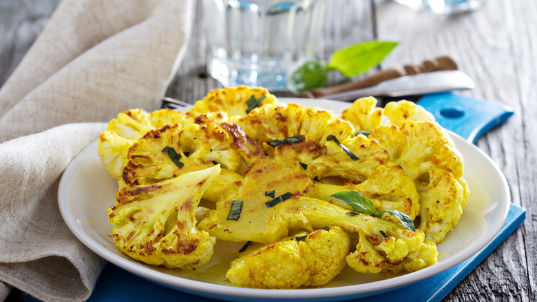 white plate of grilled cauliflower