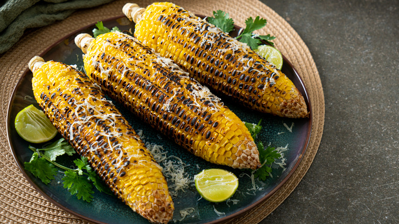 Charred corn on the cob on plate