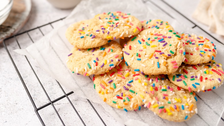 Cookies on parchment paper on a cooling rack. 