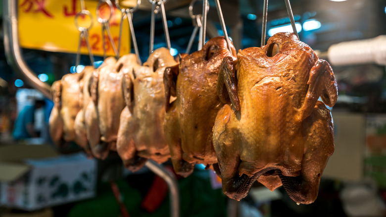 Chickens hung in a stall