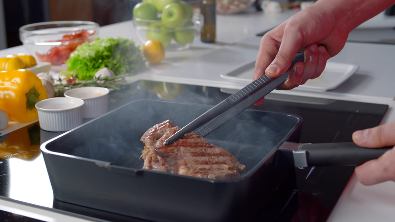 lifting steak out of pan