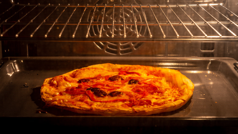 A pizza inside an oven