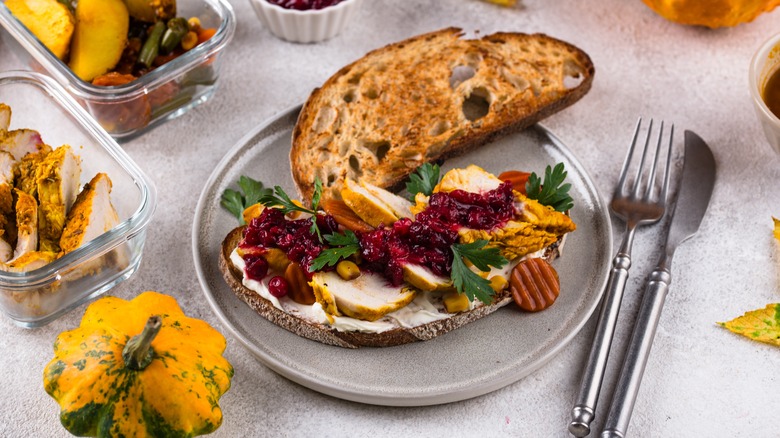 Sandwich made with Thanksgiving leftovers on plate