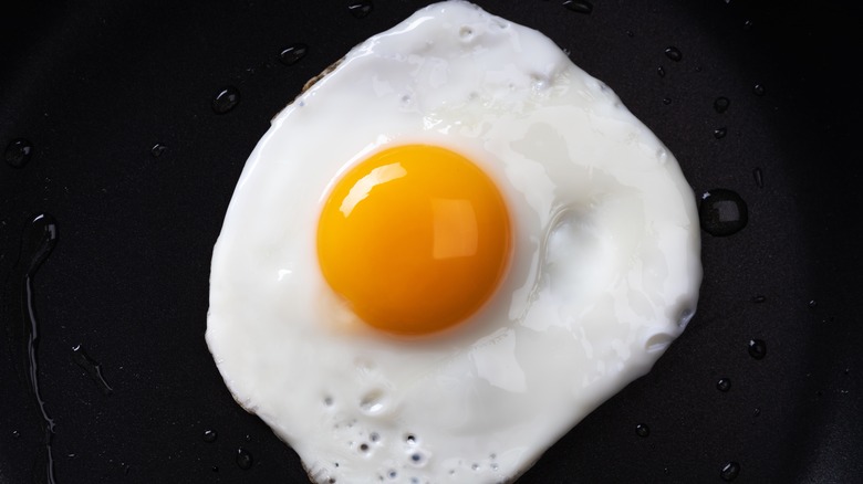 fried egg on black countertop