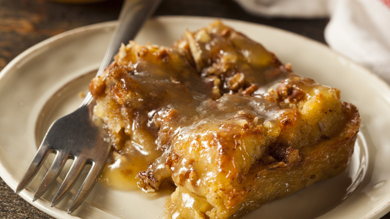 Slice of gooey cake pudding with fork