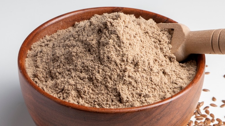 Wood bowl of brown flour