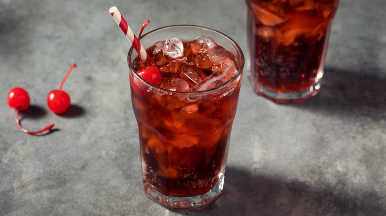 roy rogers drink in clear glass with red and white striped straw