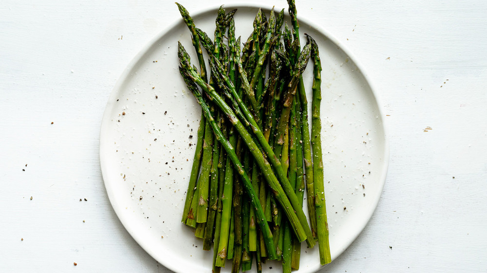 roasted asparagus on white plate