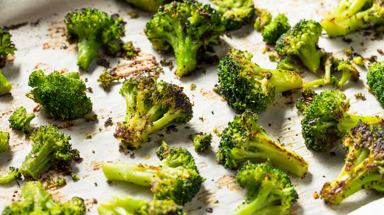 Roasted broccoli on baking sheet