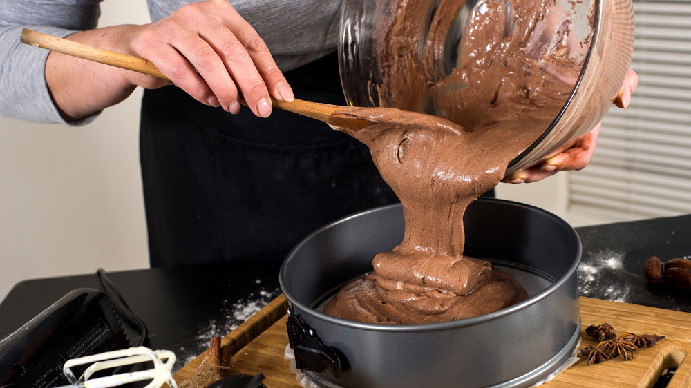 Pouring cake batter into a pan