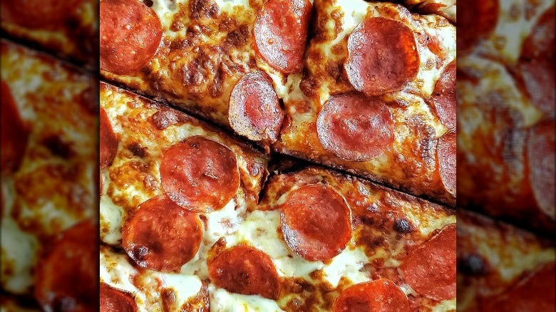 Square slices of deep dish pepperoni pizza