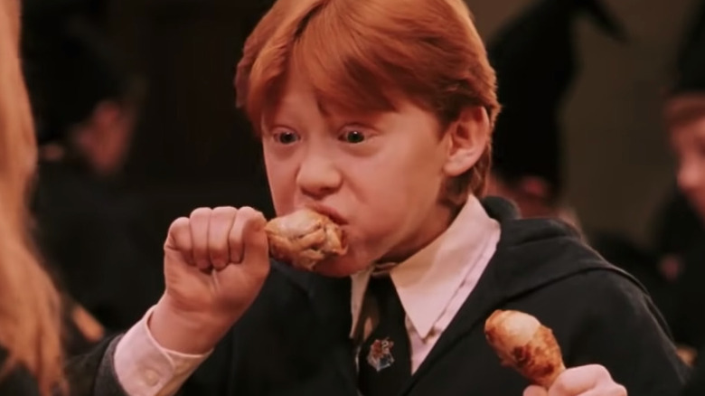 Rupert Grint eats a chicken wing