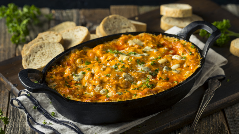 buffalo chicken dip in pan with bread