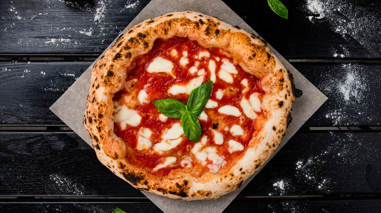 Homemade margherita pizza with basil