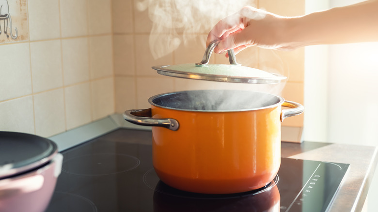 lifting lid on boiling pot