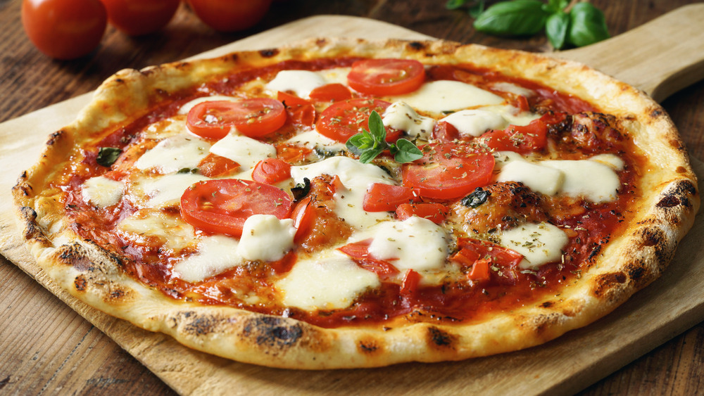 Pizza with gooey mozzarella and tomato