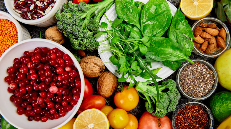 Fruit, grains, vegetables and nuts on a table. 