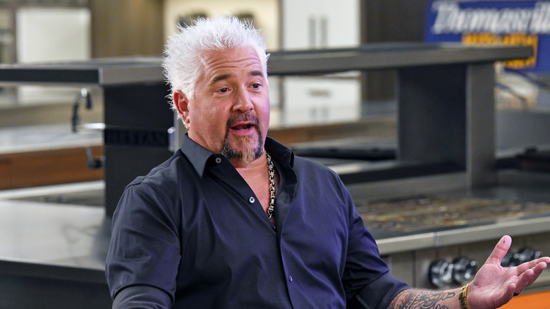 Guy Fieri in a blue shirt