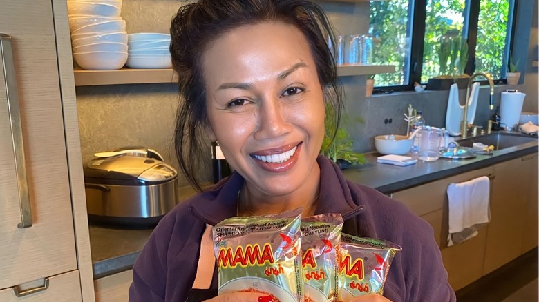 Pepper Teigen holding snack bags