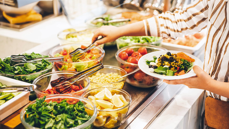 Woman taking buffet food