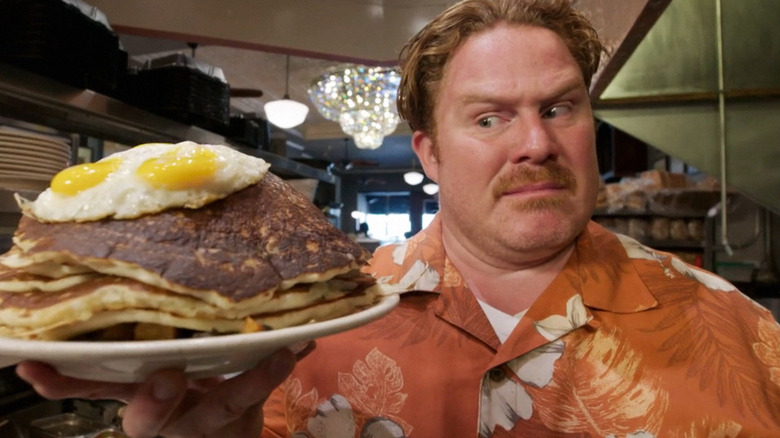 Casey Webb holding pancake platter