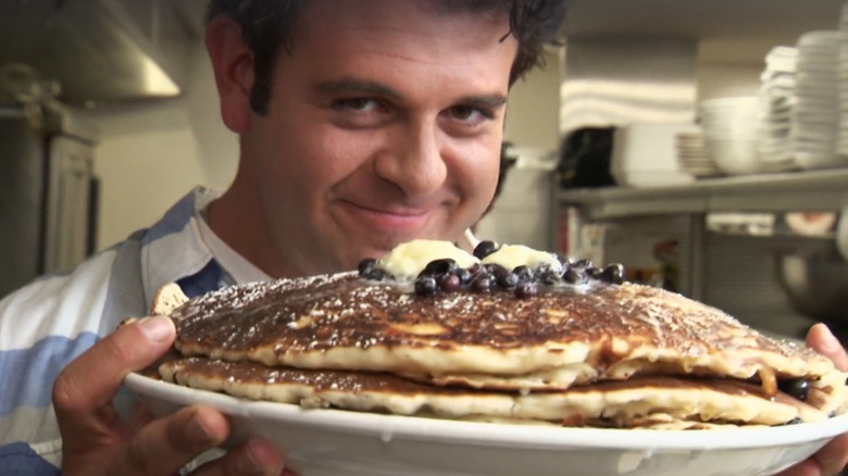 Adam Richman holding pancake plate