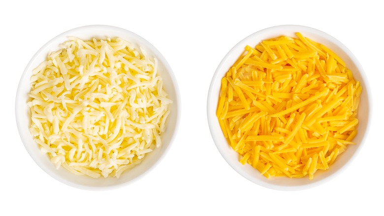 Two bowls of shredded cheese