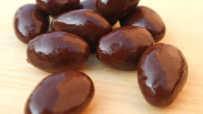 Close-up of almonds coated with dark chocolate