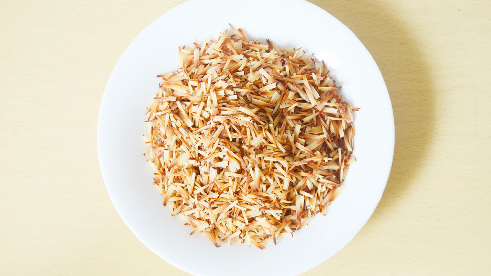 Toasted coconut in a white dish