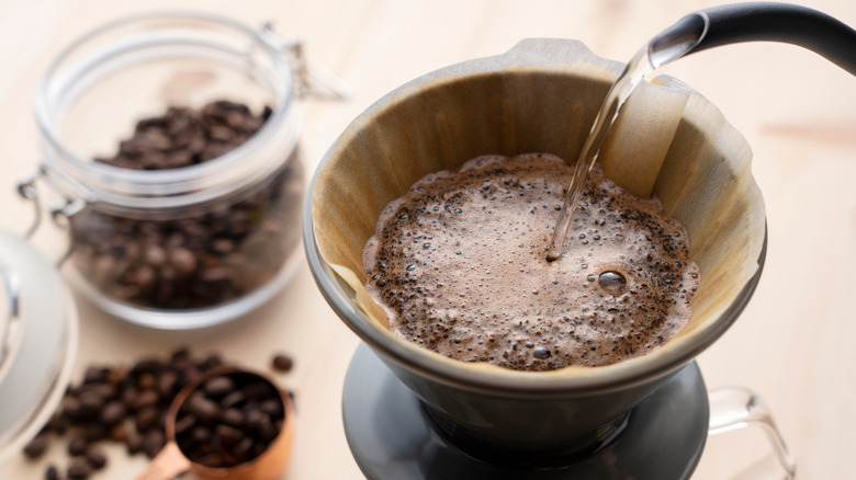 Water being poured over coffee grounds