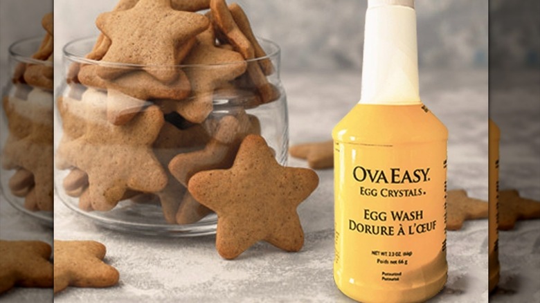 Bottle of egg wash with star cookies