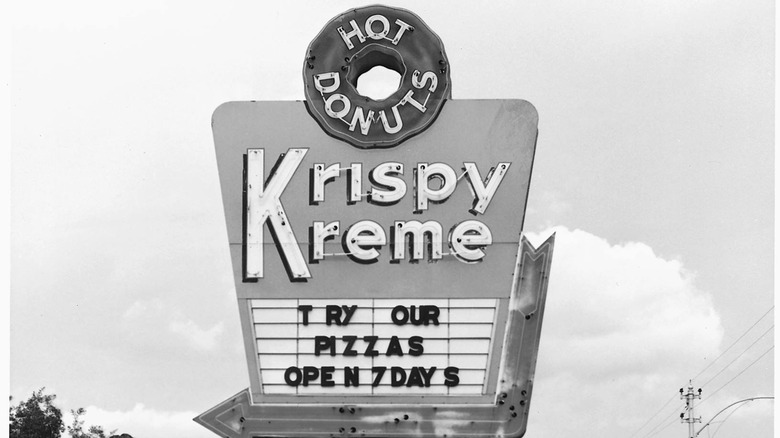 black and white krispy kreme pizza sign