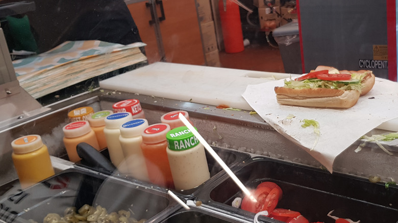 Subway sauces assembled beside sandwich