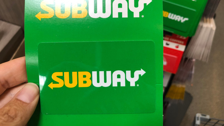 Subway gift card in hand