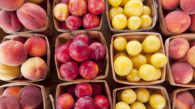 Ripe peaches and plums for sale